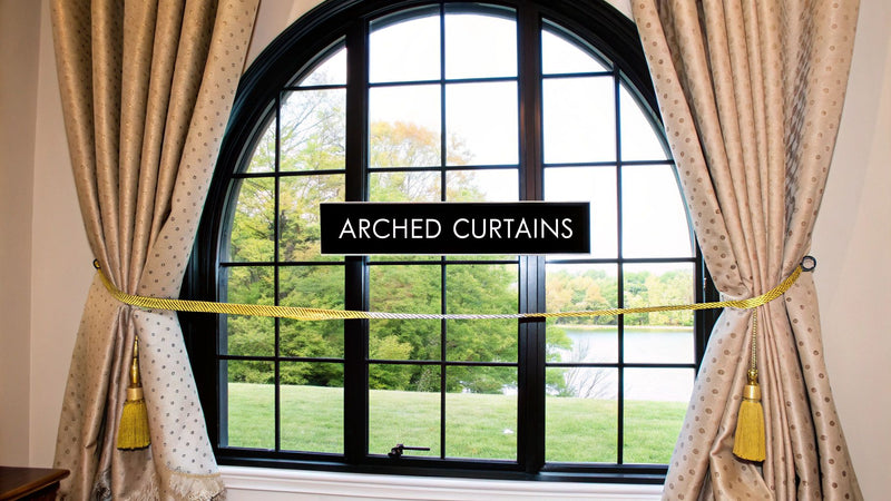 combination of arch shade and floor-length curtains on arched window