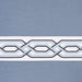 Blue geometric patterned window curtain valance fabric with a white decorative border featuring interlocking shapes.