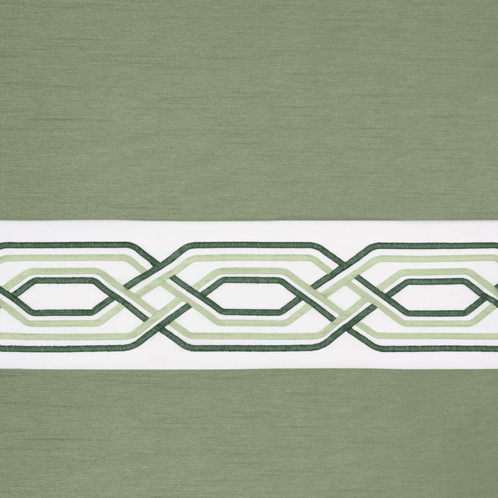 Green and white patterned window curtain valance with geometric design.