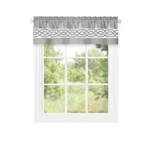 Light filtering window curtain valance with geometric design, 55x13 inches, in grey, displayed on a window with greenery outside.