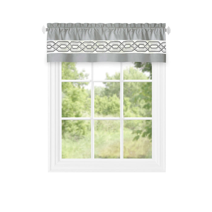 Light filtering window curtain valance with geometric design, 55x13 inches, in grey, displayed on a window with greenery outside.