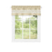 Beige window curtain valance with geometric pattern on a white window frame, filtering light into a bright, green outdoor view.